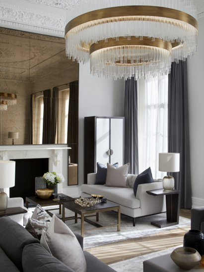 Grand gold and glass light and pale gold and beige living room